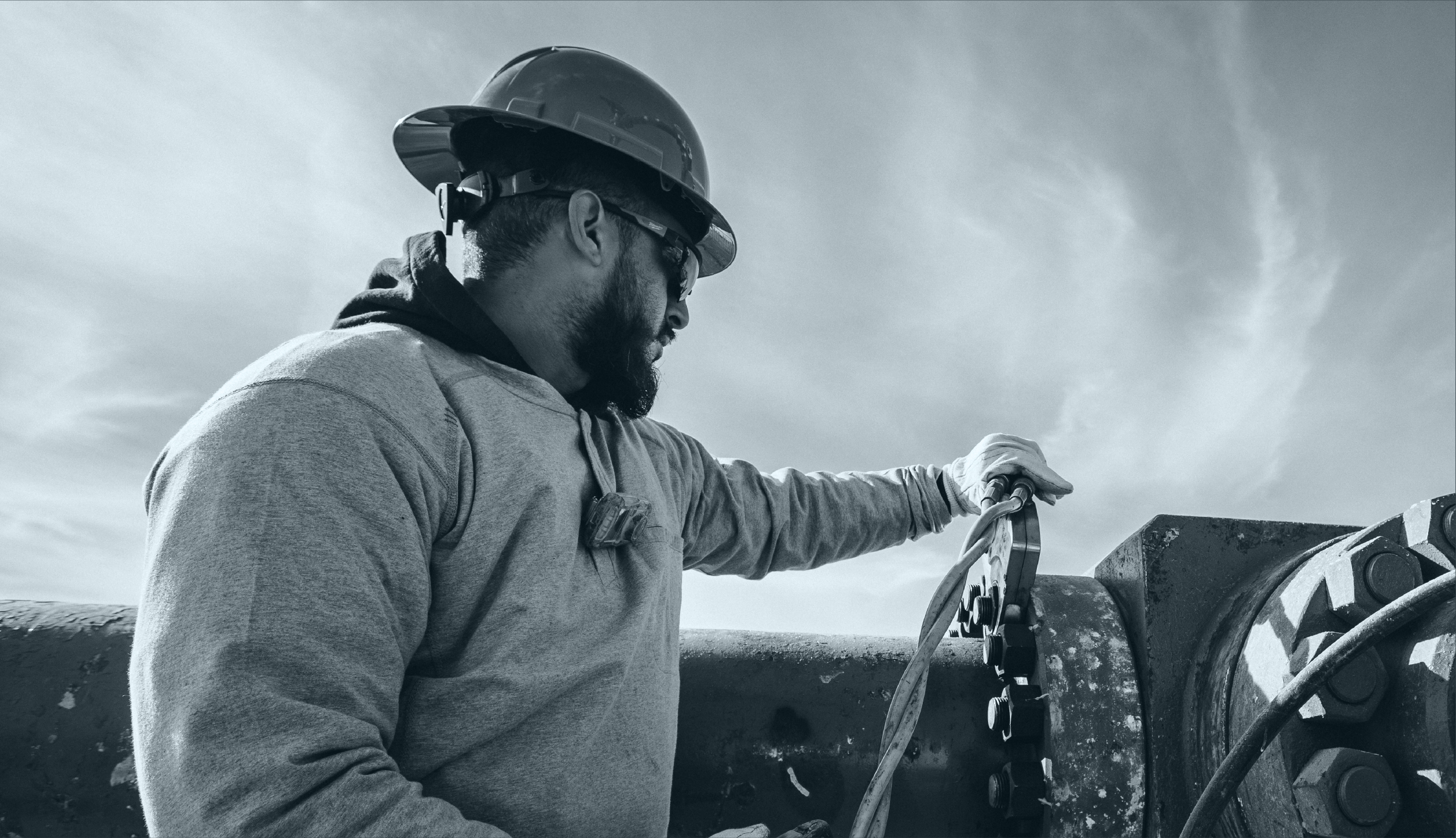 Tres Energy team member working alongside an energy operator in the field