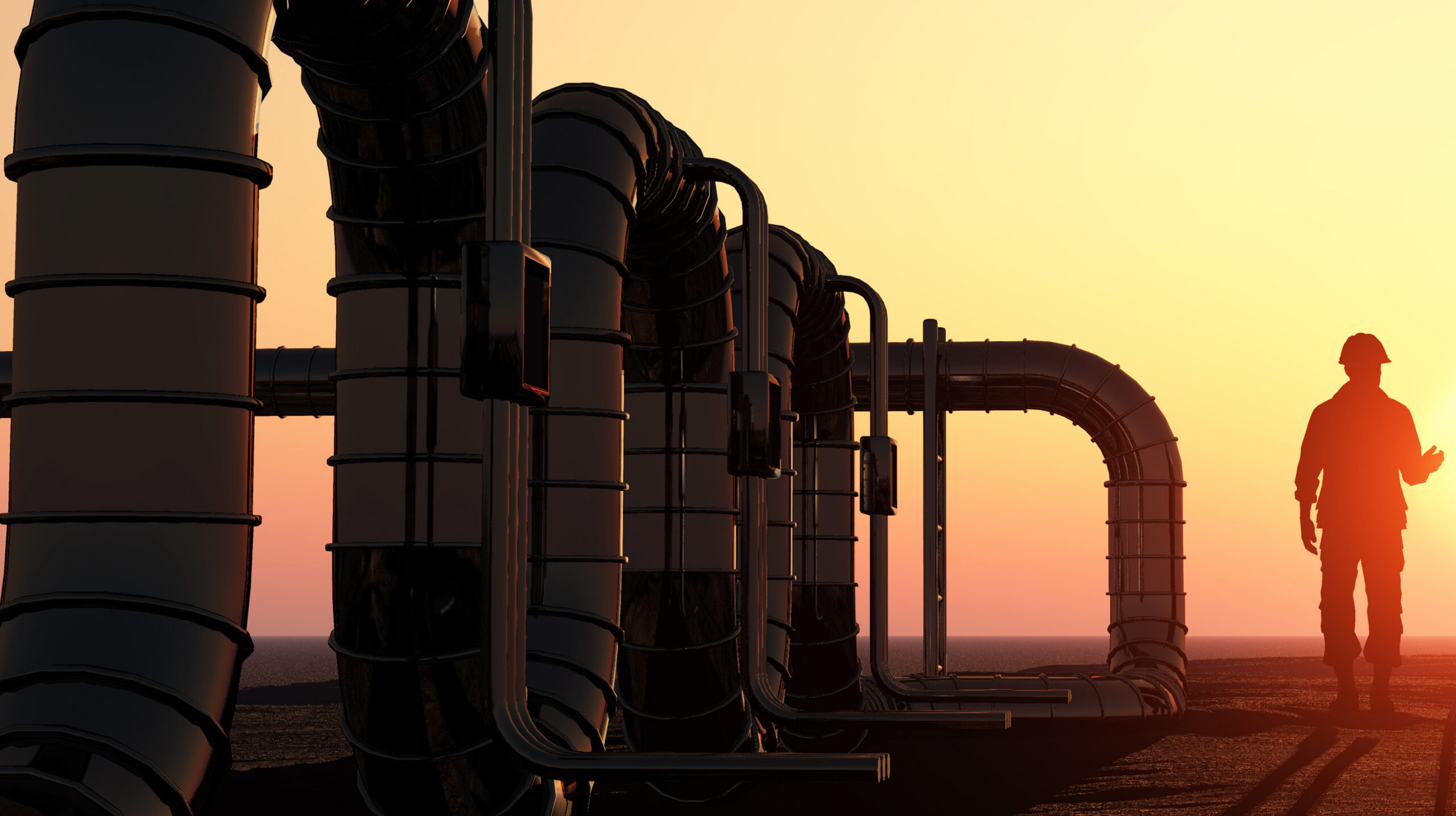Energy operator working on pipeline infrastructure at golden hour