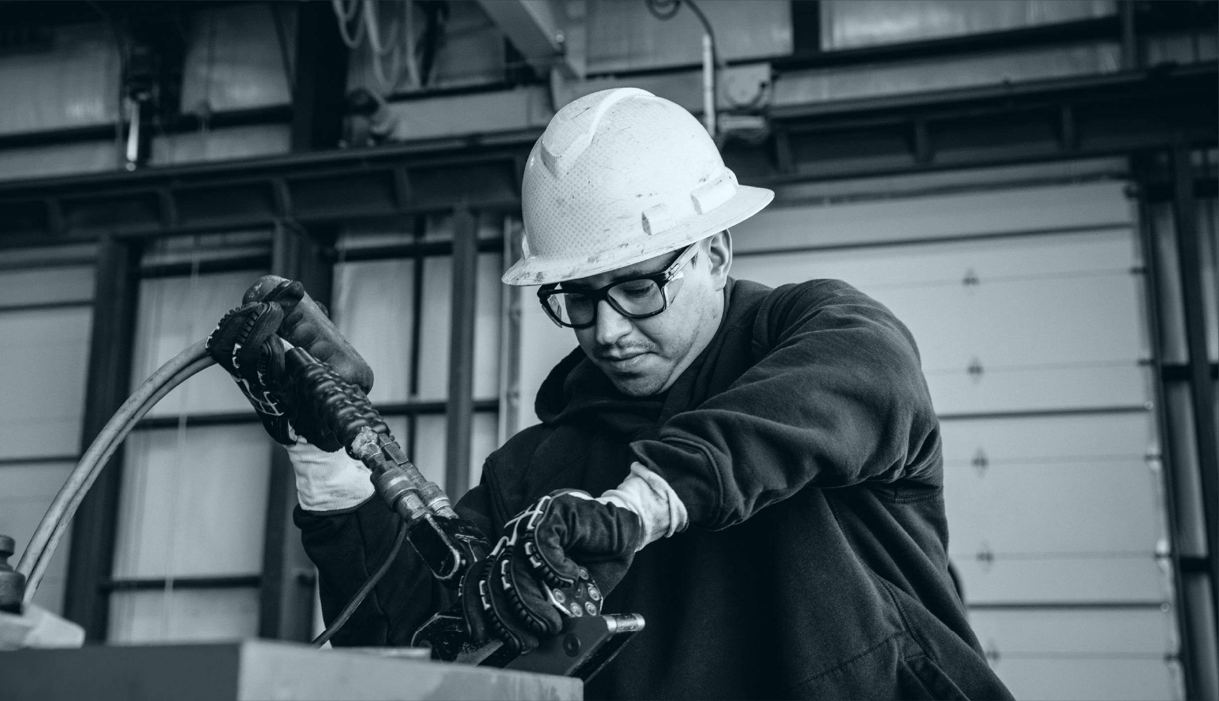 Tres Energy team member working on industrial energy operations equipment